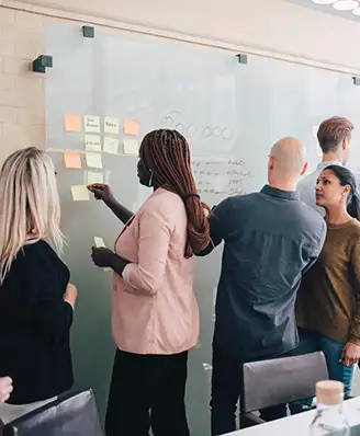 People working on an ideation wall