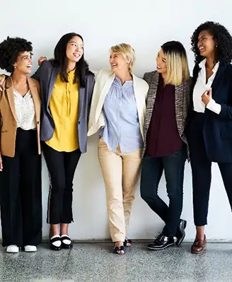 Group of women posing for a photo after a business meeting