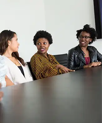 Diverse women talking at a table