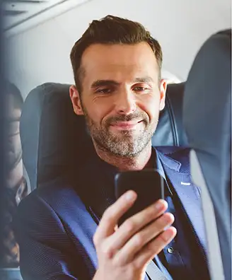 Person learning on his phone while traveling