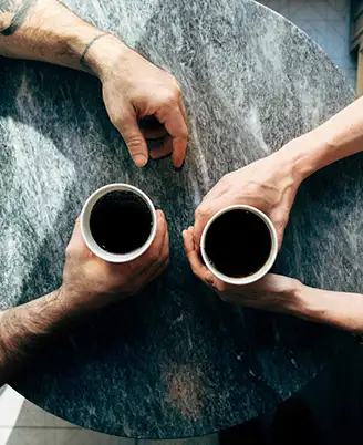 Two people having coffee